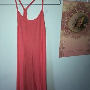Salmon colored tank top.
